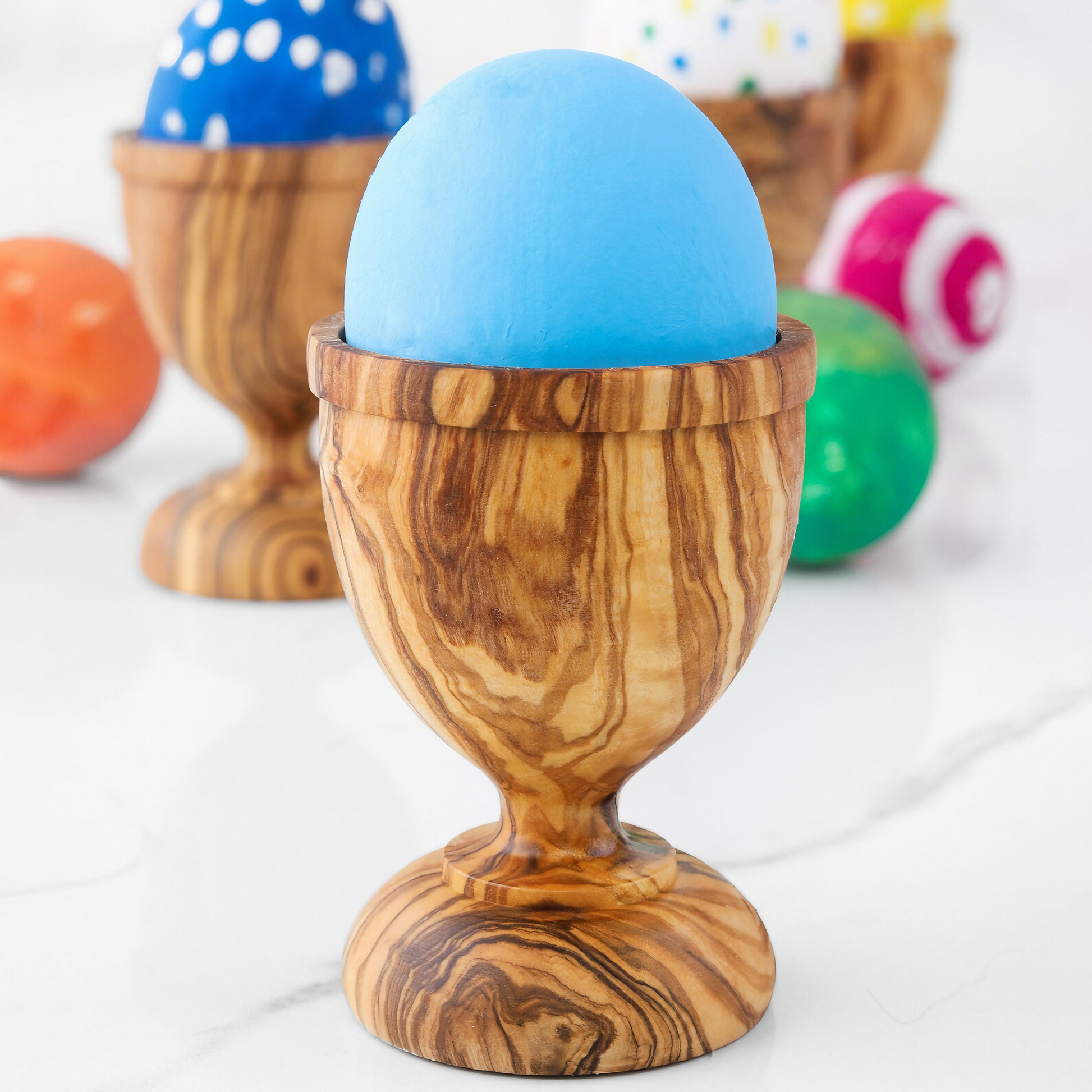 Eierbecher aus Olivenholz mit natürlicher Maserung, ideal zum stilvollen Servieren von Eiern