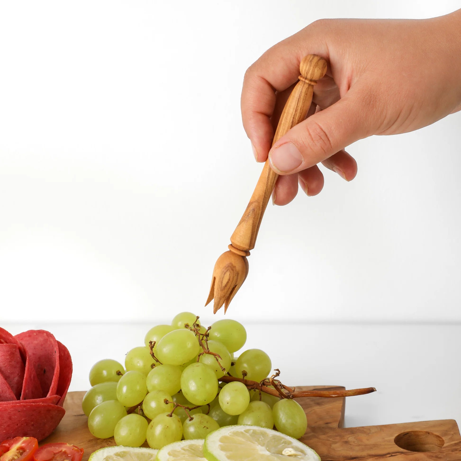 Von tunesischen Kunsthandwerkern handgeschnitzter Olivenholz Picker mit natürlicher Maserung